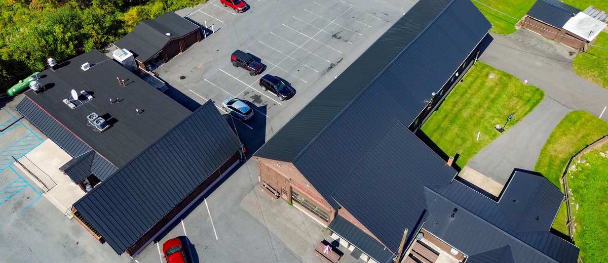 Aerial view of a commercial building with a new low slope roof