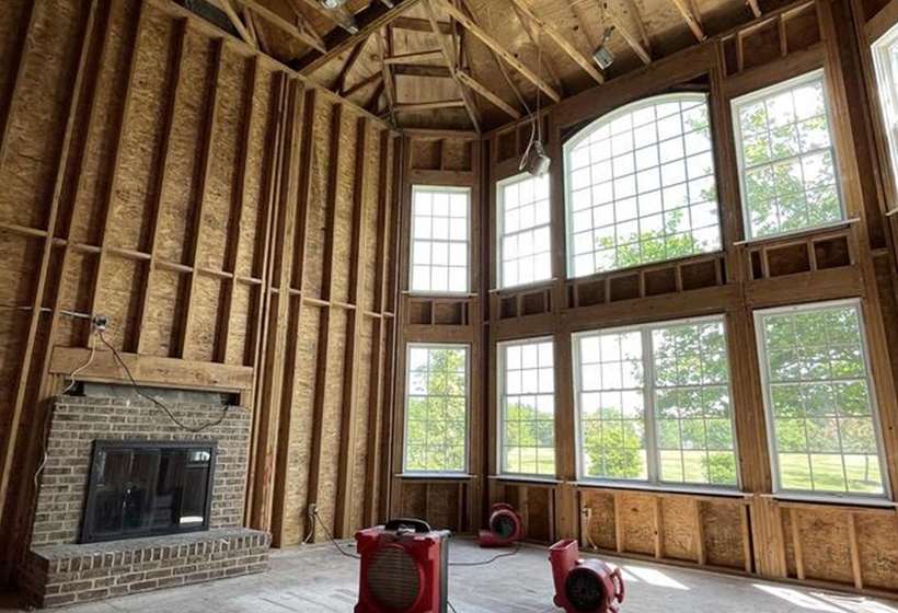 Interior storm damage stripped back to the framing before restoration