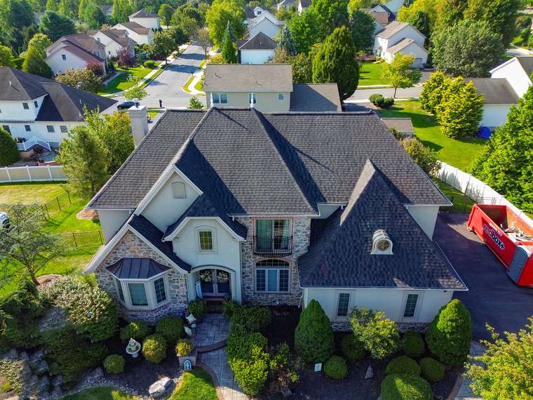 Large residential home with a new architectural asphalt shingle roof
